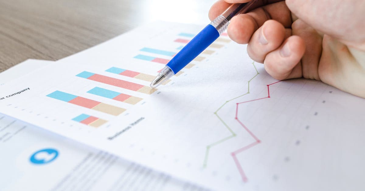 Financial ledger and records on a desk representing structured audit documentation